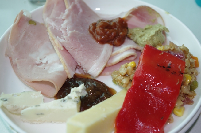 Cold cuts and antipasto condiments.